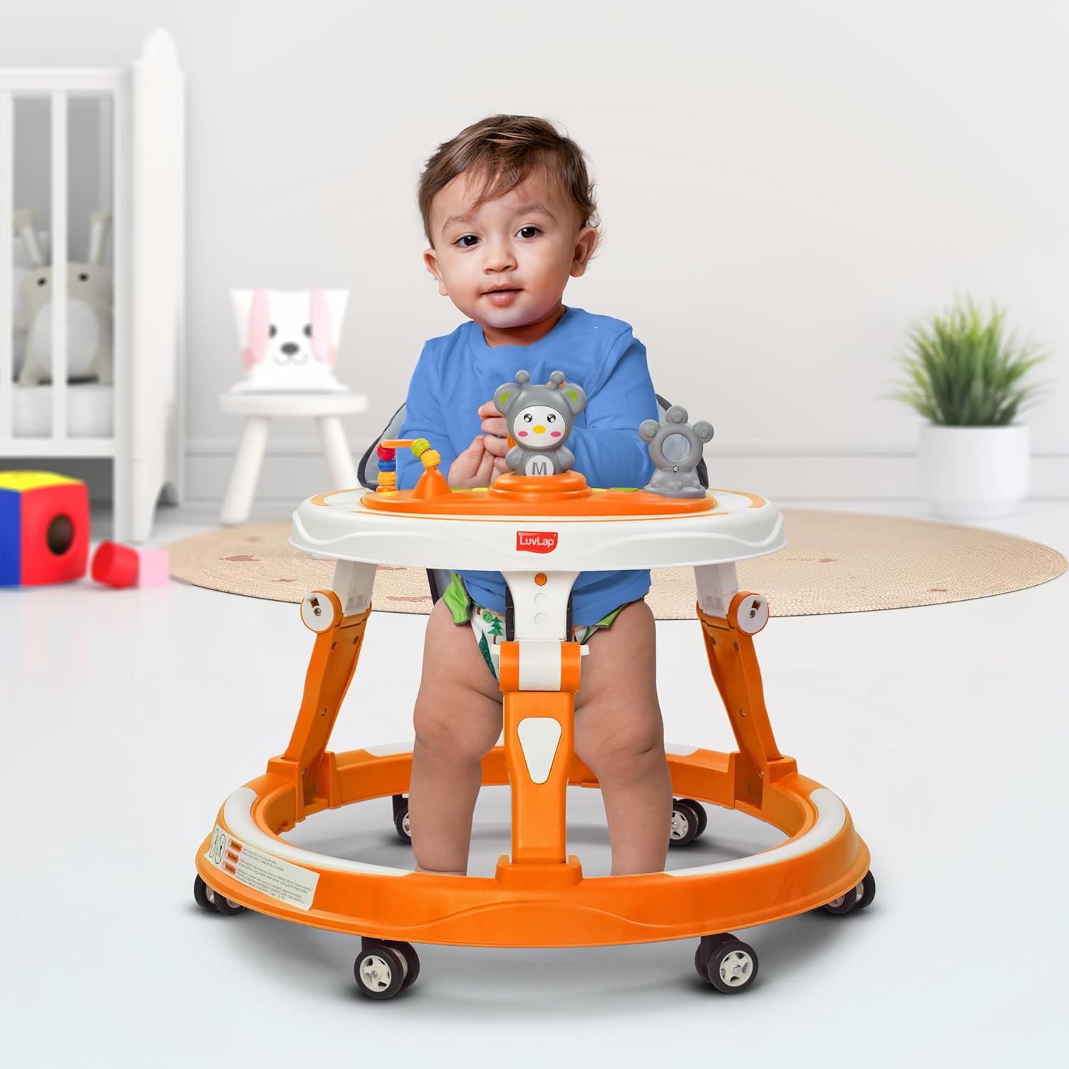 Bright orange baby walker with stimulating toys, designed for promoting baby's mobility and development. www.usmile.toys